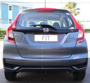 Honda Fit REAR VIEW, SILVER COLOR, IN FRONT OF AUTO SOLUTIONS SHOWROOM