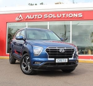 Hyundai Creta 2021, front view, blue color, outside of Auto Solutions showroom