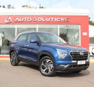 Hyundai Creta 2021, front right side view, blue color, outside of Auto Solutions showroom