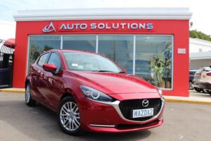 Mazda 2 soul crystal red, outside of Auto Solutions